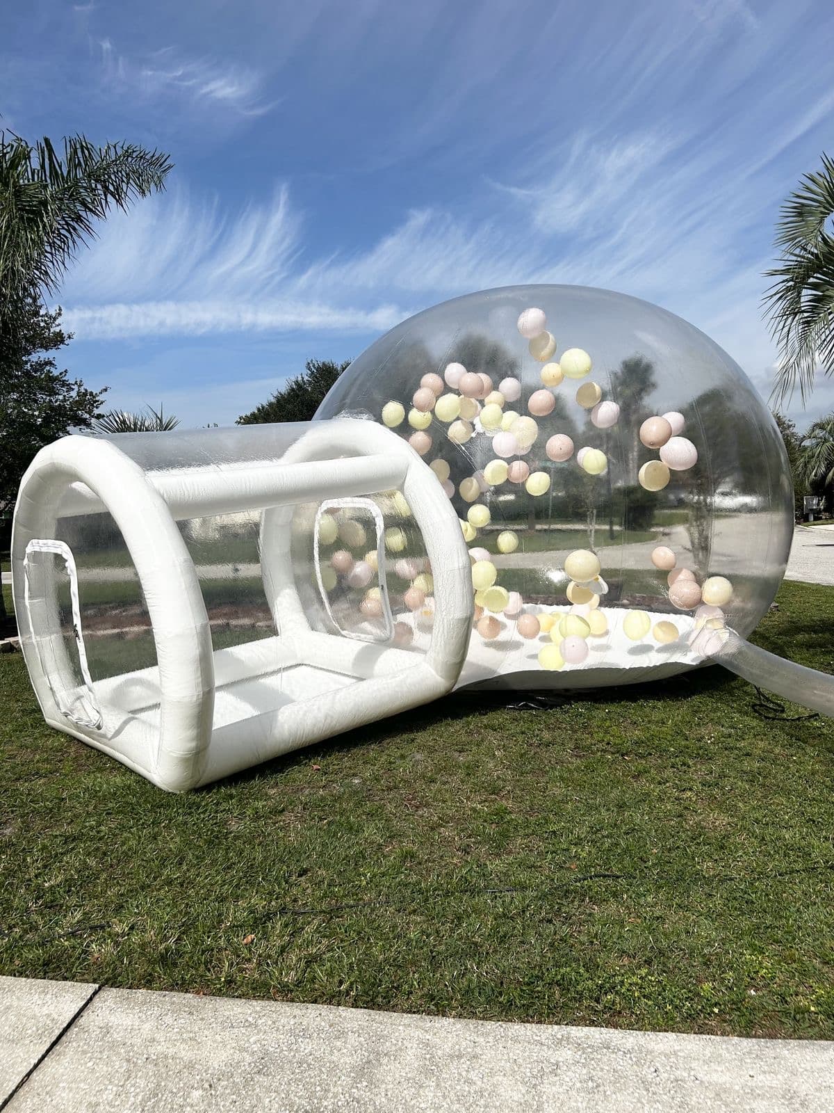Clear bubble house rental in Miami with pastel balloons inside